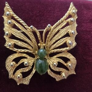Elegant Gold Butterfly Brooch with Green Accents